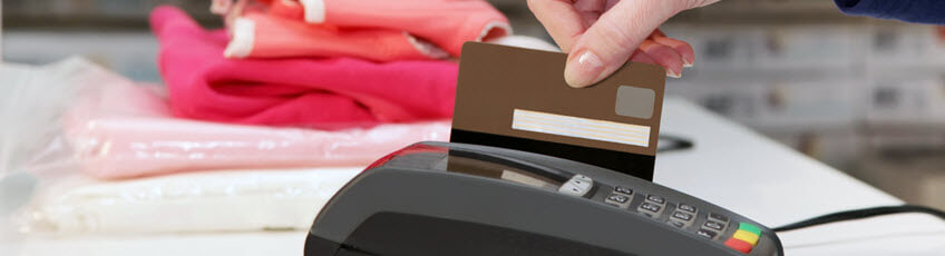 Credit card being swiped for payment